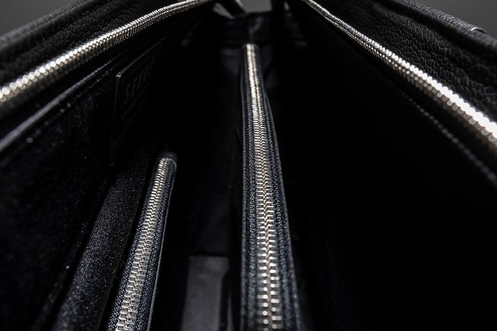 3 main compartments with one zipped compartment; 1 zipped pocket for purse and credit cards, 1 slot pocket for mobile phone